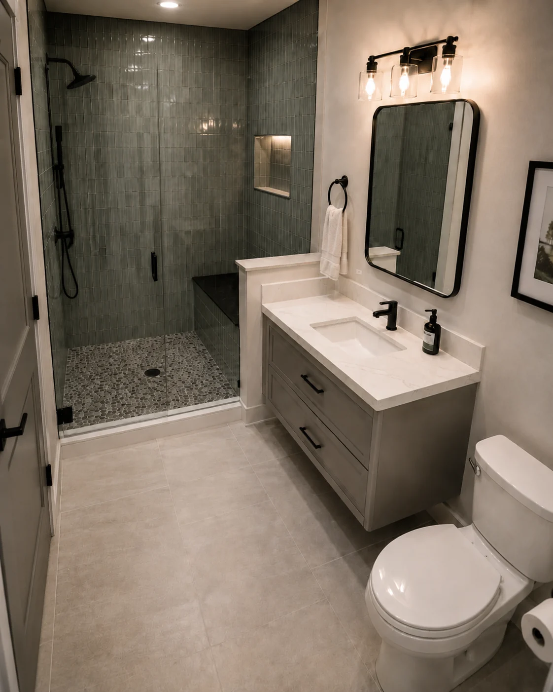 Moody-luxe Ottawa bathroom with dark tile and black fixtures